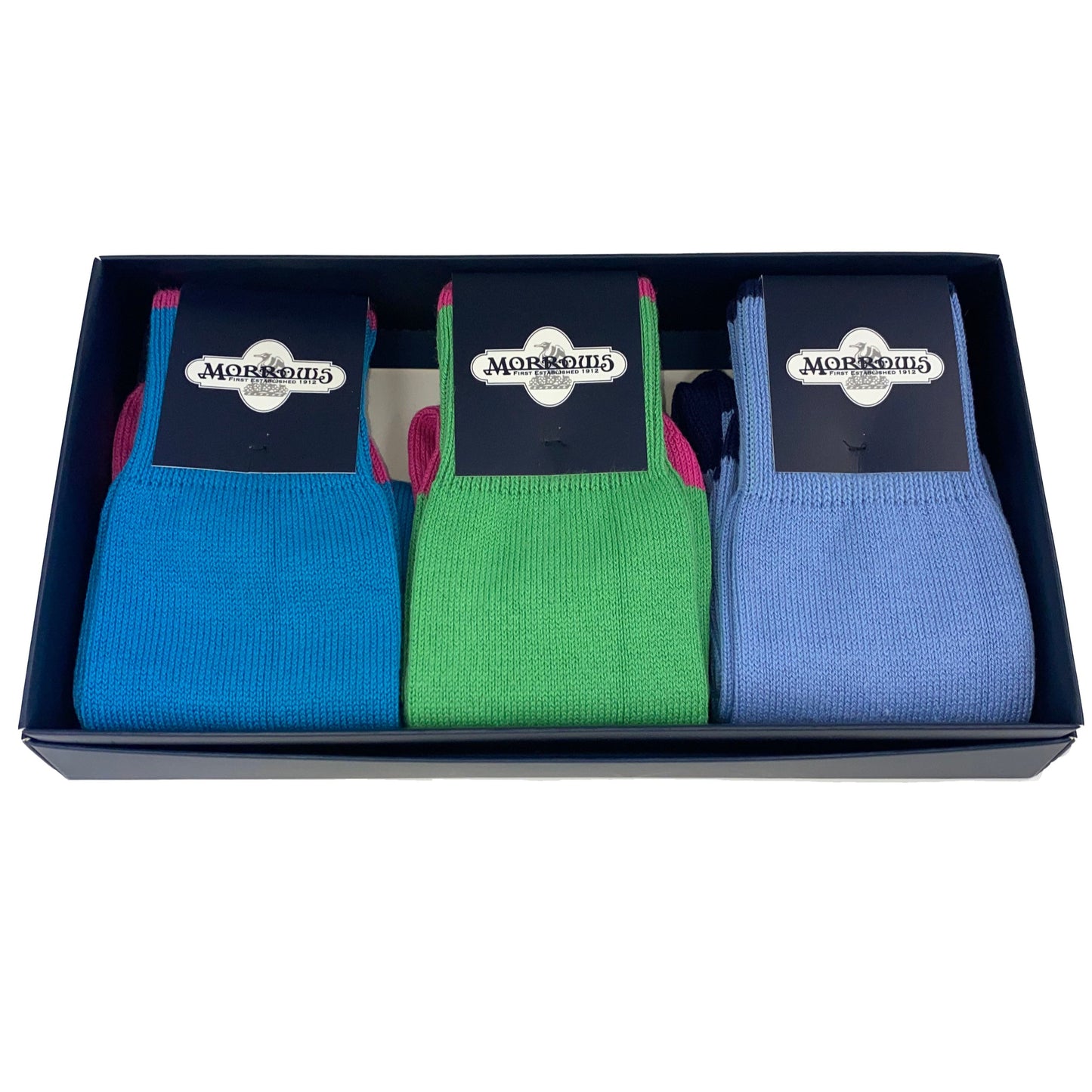 Gift box of three thin socks. Left to right: blue with pink heel, green with pink heel, sky blue with navy heel.